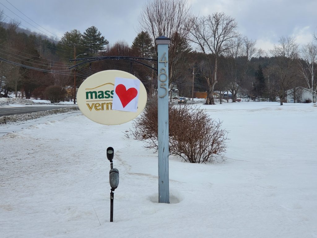 Red heart stuck to Massage Vermont's roadside sign